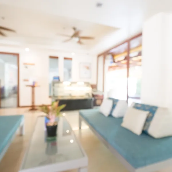Room With Blue Couchs With White Cushions